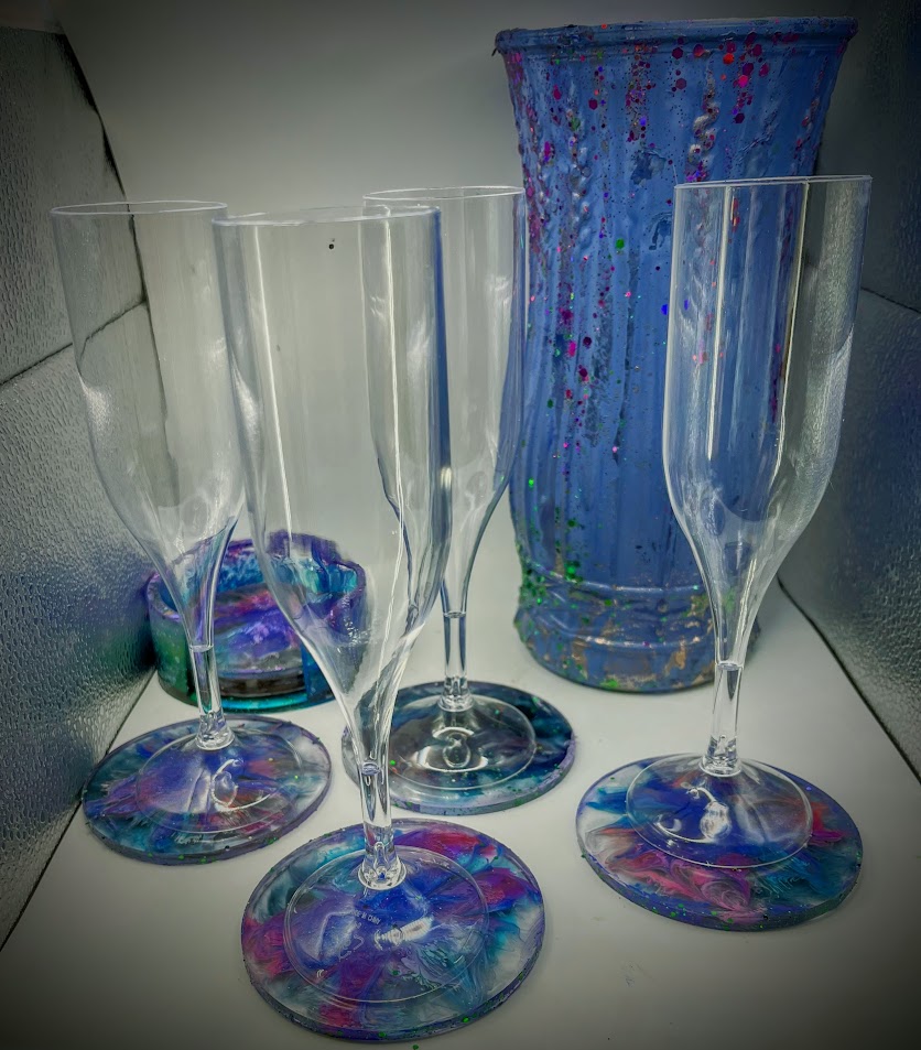 resin art purple coasters with vase in blue with purple glitter.