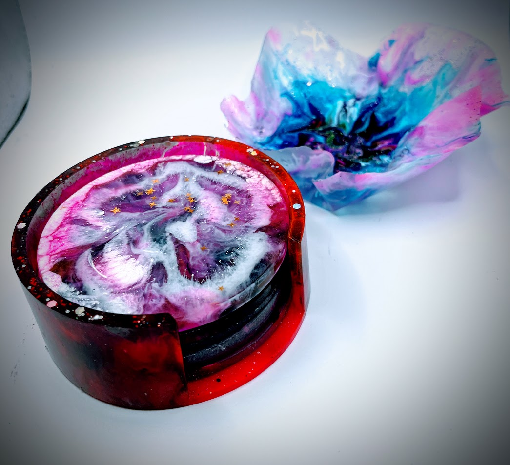 Resin coasters: pink floral bloom pattern, alongside pink resin bowl part of "Friendship" Collection